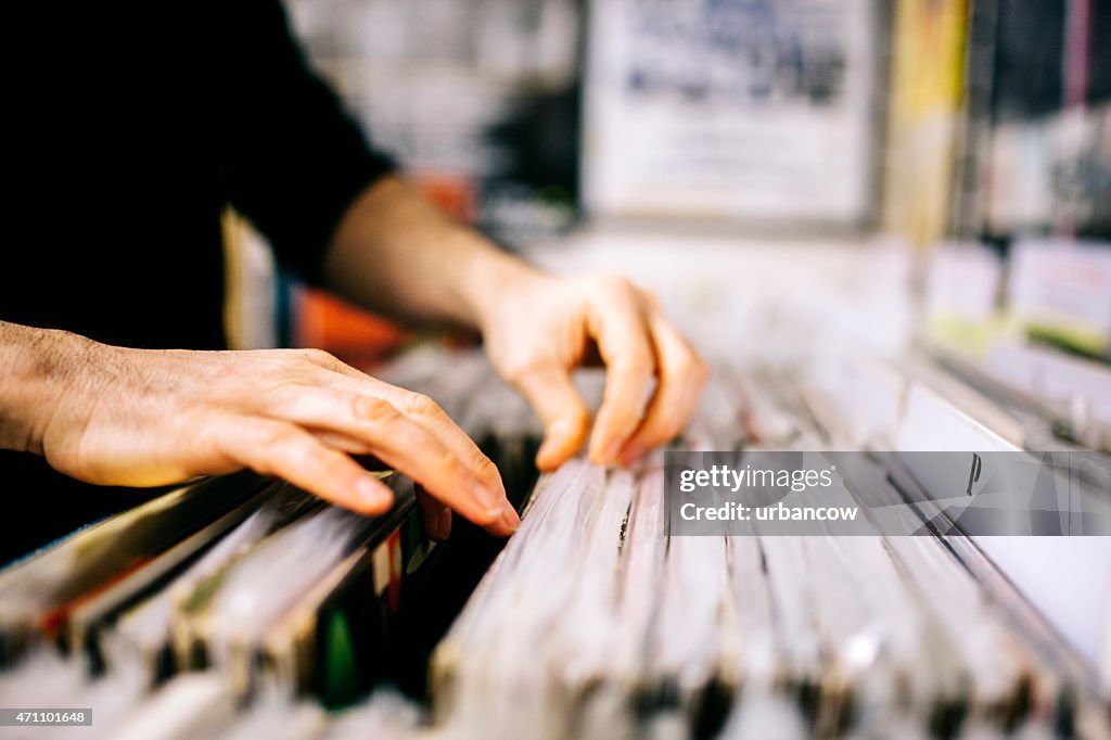 Record store, second hand vinyl records, hands searching