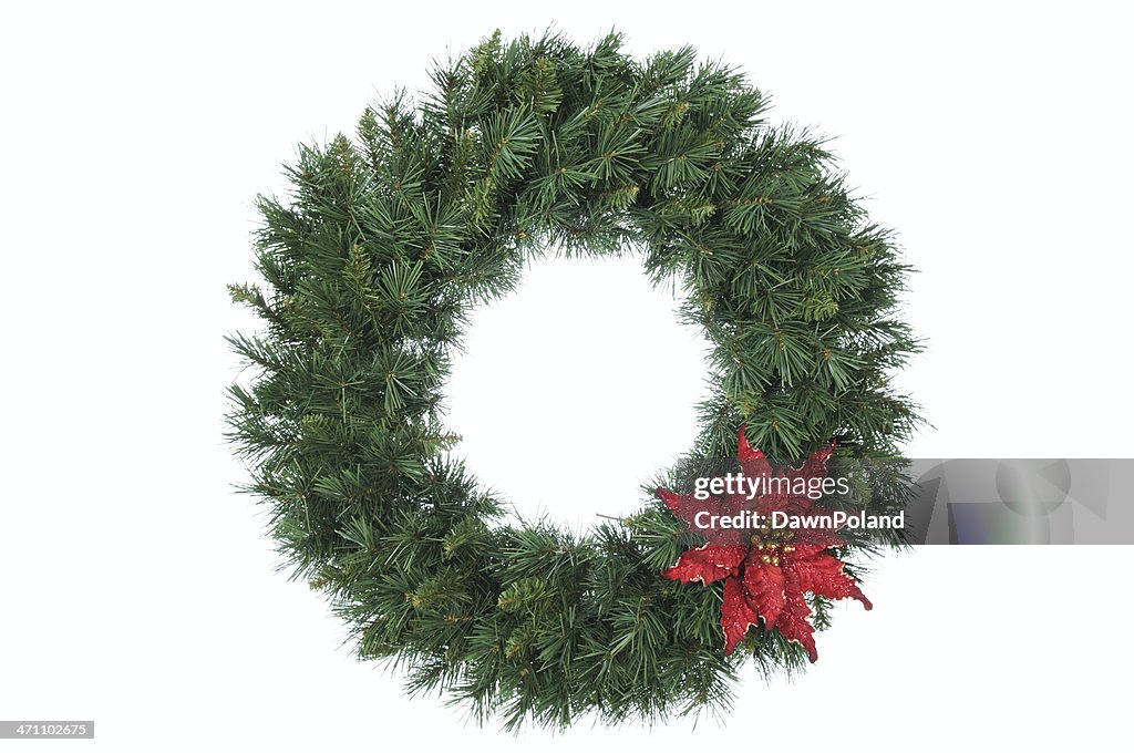 Vivid evergreen wreath, trimmed with a red bow 