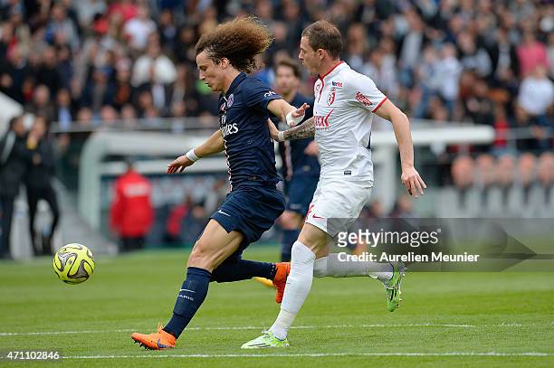 David Luiz of PSG and Nolan Roux of Llosc Lille in action during the Ligue 1 game between Paris Saint Germain and Llosc Lille at Parc des Princes on...