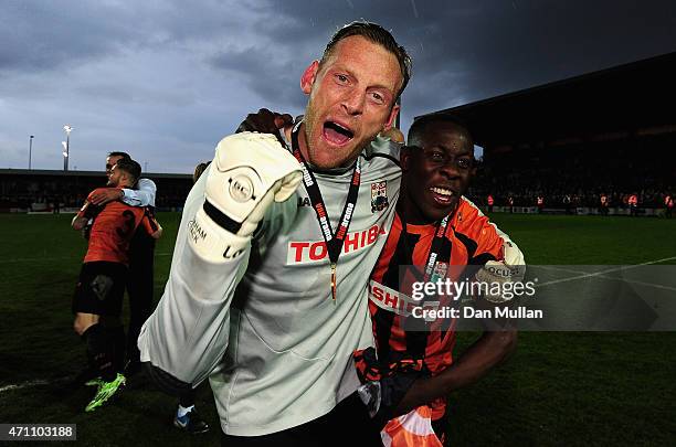 Andy Yiadom and Graham Stack of Barnet celebrate their team winning promotion during the Vanarama Football Conference League match between Barnet and...