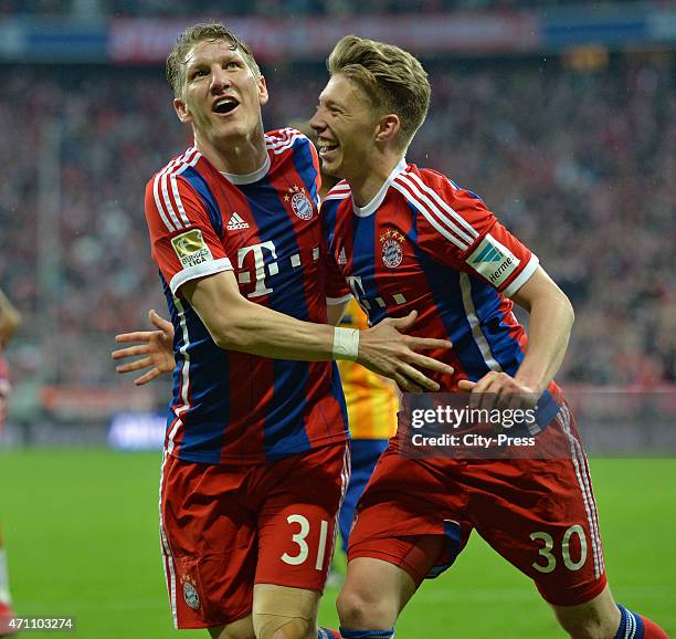 Bastian Schweinsteiger and Mitchell Weiser of Bayern Muenchen celebrate after scoring the 1:0 during the game FC Bayern Muenchen against Hertha BSC...