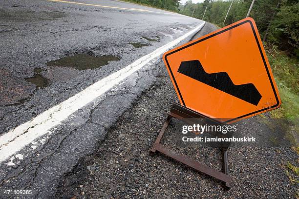 bump sign - bumpy road stock pictures, royalty-free photos & images