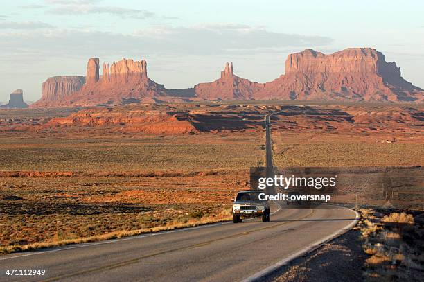dawn at monument valley - desert road stock pictures, royalty-free photos & images