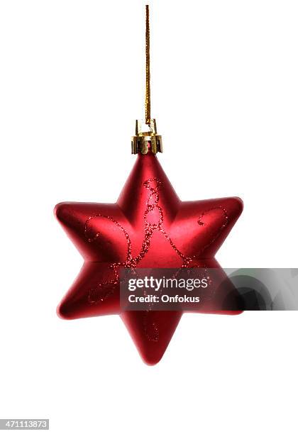 red christmas star isolated on white background - tree topper stock pictures, royalty-free photos & images