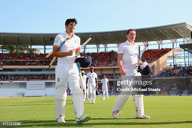 Alastair Cook of England undefeated on 59 runs and Gary Ballance undefeated on 81 runs celebrate victory by nine wickets over West Indies during day...