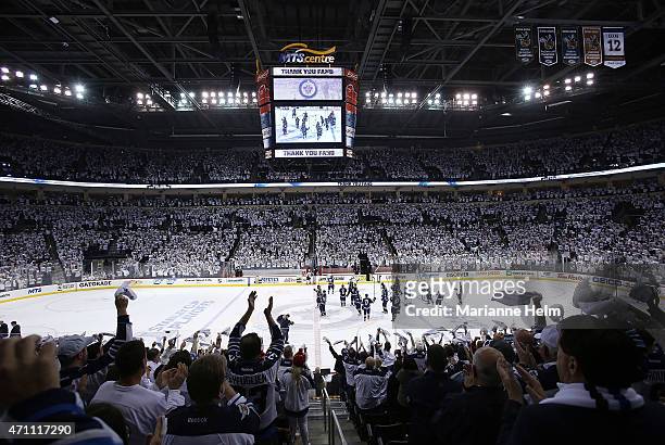 Fans give the Winnipeg Jets a standing ovation as they salute the crowd after they lost to the Anaheim Ducks 5-2 in Game Four of the Western...