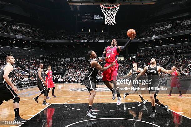 Paul Millsap of the Atlanta Hawks shoots against the Brooklyn Nets in Game Three of the Eastern Conference Quarterfinals during the 2015 NBA Playoffs...