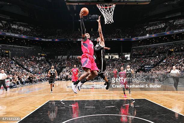 Paul Millsap of the Atlanta Hawks shoots against the Brooklyn Nets in Game Three of the Eastern Conference Quarterfinals during the 2015 NBA Playoffs...