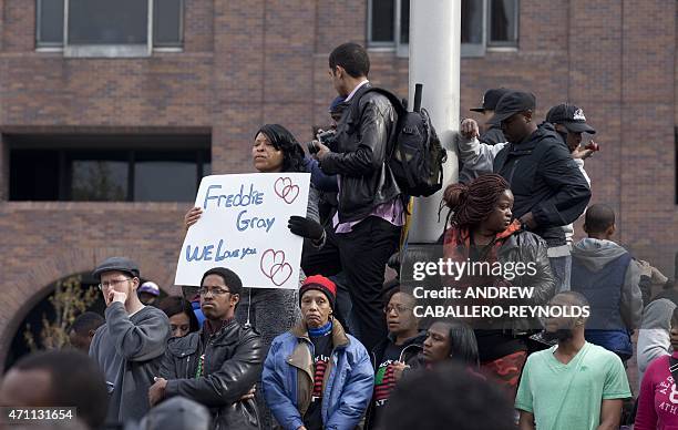 Protesters look on during a rally in Baltimore, Maryland, on April 25 against the death of Freddie Gray while in police custody. Organizers...