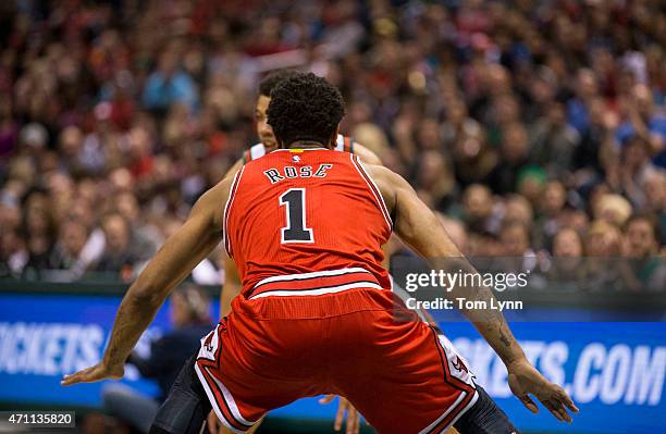 Guard Derrick Rose of the Chicago Bulls plays defense as guard Michael Carter-Williams of the Milwaukee Bucks looks to drive in the first quarter of...