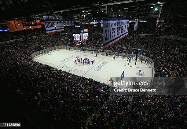 The New York Islanders celebrate their 3-1 victory over the Washington Capitals in Game Six of the Eastern Conference Quarterfinals during the 2015...