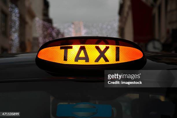taxi sign - london taxi stock pictures, royalty-free photos & images
