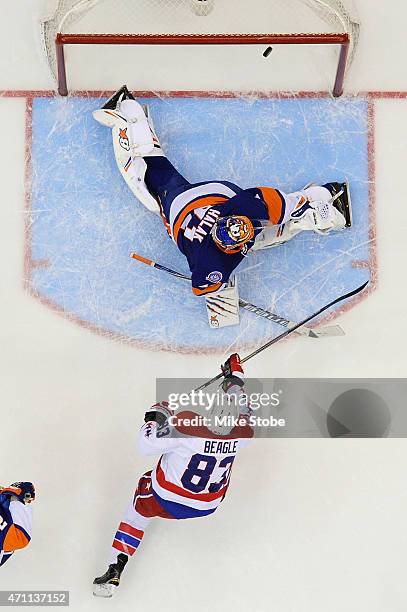 Jay Beagle of the Washington Capitals hits the crossbar against Jaroslav Halak of the New York Islanders in the third period during Game Six of the...