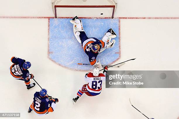 Jay Beagle of the Washington Capitals hits the crossbar against Jaroslav Halak of the New York Islanders in the third period during Game Six of the...