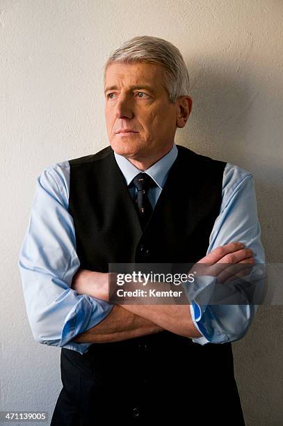 senior businessman - man with shirt sleeves rolled up waistcoat stock pictures, royalty-free photos & images