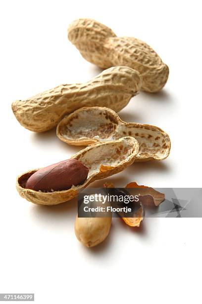 nuts: peanuts isolated on white background - peanuts stock pictures, royalty-free photos & images