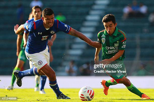 Francisco Rodriguez of Cruz Azul struggles for the ball with Christian Bermudez of Chiapas during a match between Cruz Azul and Chiapas as part of...