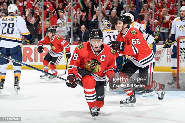 Jonathan Toews of the Chicago Blackhawks reacts in front of Andrew Shaw after scoring against the Nashville Predators in the first period in Game Six...