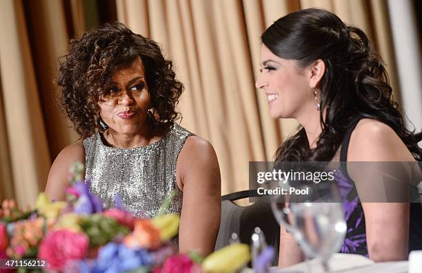 Saturday Night Live's comedian Cecily Strong speaks with First Lady Michelle Obama at the annual White House Correspondent's Association Gala at the...