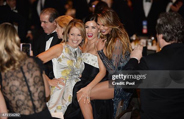 American journalist and author Katie Couric, Jenna Dewan-Tatum and Chrissy Teigen attend the annual White House Correspondent's Association Gala at...