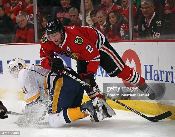 Duncan Keith of the Chicago Blackhawks knocks down Taylor Beck of the Nashville Predators and steals the puck in Game Six of the Western Conference...