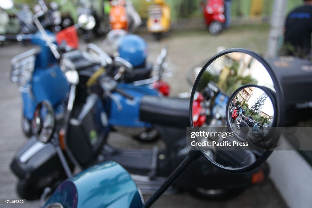 European scooters are reflected through a mirror during the...