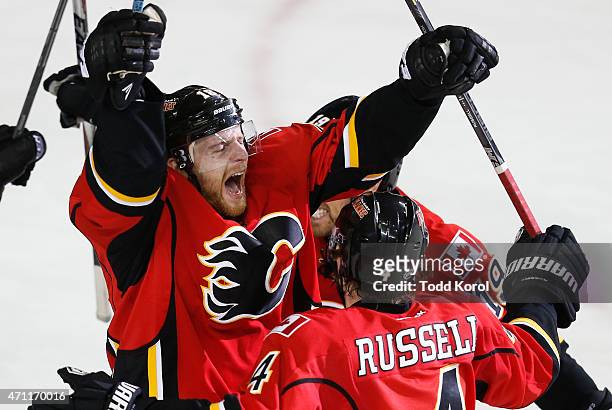Matt Stajan celebrates his game winning goal with Kris Russell and David Jones against the Vancouver Canucks in Game Six of the Western Conference...