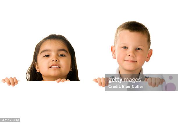 two children holding a blank sign - kid peeking stock pictures, royalty-free photos & images