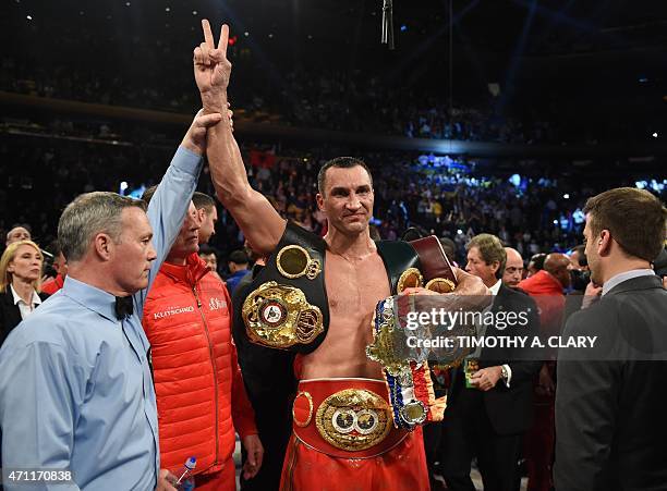 Wladimir Klitschko of the Ukraine celebrates his win over Bryant Jennings of the US after their World Heavyweight Championship boxing bout at Madison...