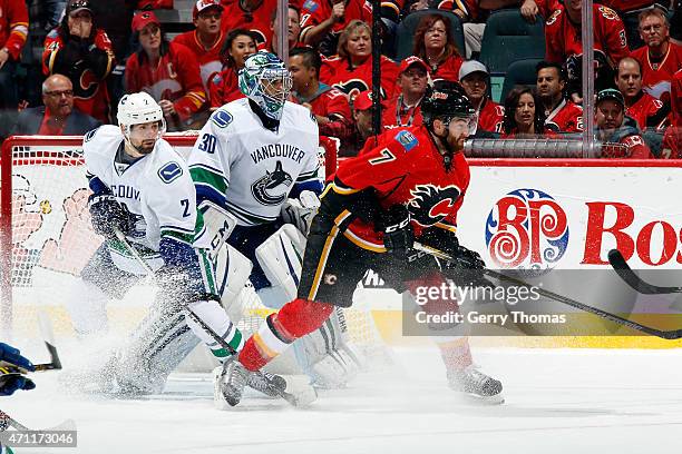 Brodie of the Calgary Flames skates against Dan Hamhuis of the Vancouver Canucks at Scotiabank Saddledome for Game Six of the Western Quarterfinals...