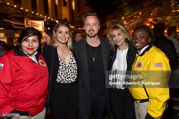 Lauren Parsekian, actor Aaron Paul and co-chair of 20th Century Fox Stacey Snider pose with City Year AmeriCorps members at City Year Los Angeles...