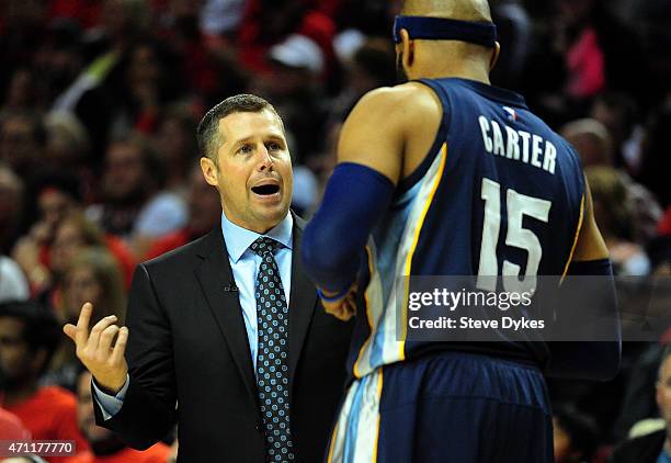 David Joerger of the Memphis Grizzlies speaks with Vince Carter of the Memphis Grizzlies during the third quarter in Game Three of the Western...