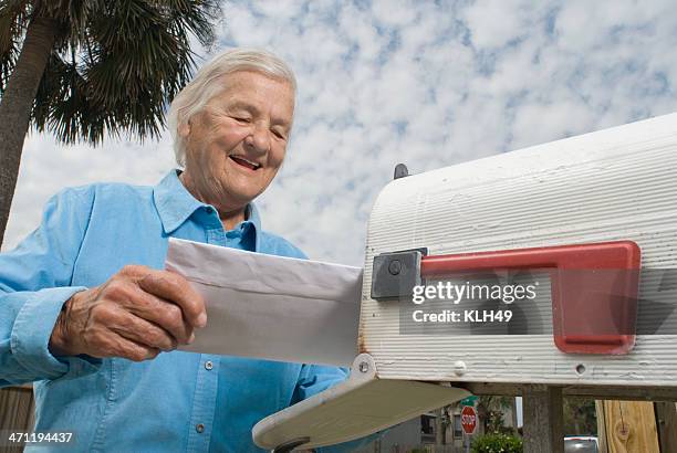 grandma gets a letter - good news letter stock pictures, royalty-free photos & images