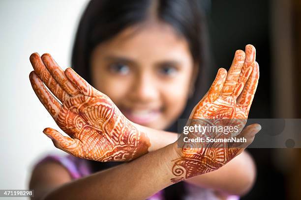 little girl displaying henna tattoo also called mehendi - henna hand stockfoto's en -beelden