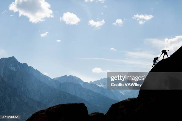 helping climbers - word meaning stock pictures, royalty-free photos & images