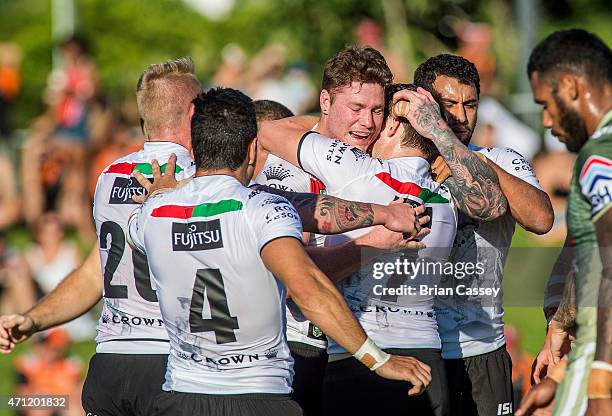 Rabbitohs Chris McQueen is congratulated after scoring a try during the round eight NRL match between the South Sydney Rabbitohs and the Canberra...