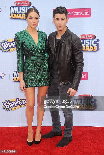 Singer Nick Jonas and Olivia Culpo arrive at the 2015 Radio Disney Music Awards at Nokia Theatre L.A. Live on April 25, 2015 in Los Angeles,...