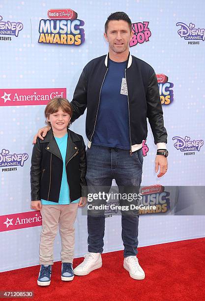 Galaxy player Robbie Keane and son Robert Ronan Keane arrive at the 2015 Radio Disney Music Awards at Nokia Theatre L.A. Live on April 25, 2015 in...