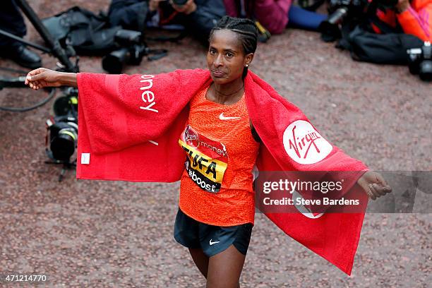 Tigist Tufa of Ethiopia celebrates after winning Women's race during the Virgin Money London Marathon on April 26, 2015 in London, England.