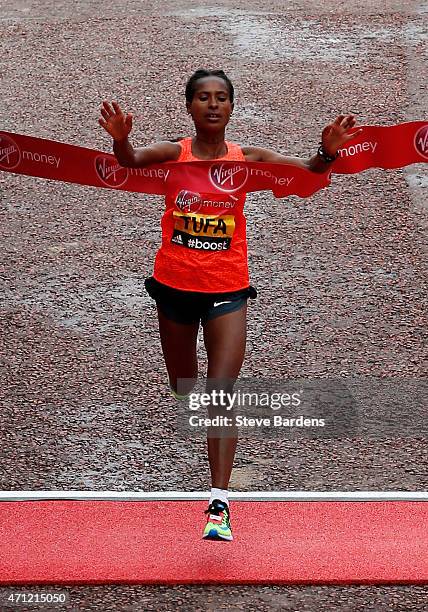 Tigist Tufa of Ethiopia crosses the finish line to win the Women's race during the Virgin Money London Marathon on April 26, 2015 in London, England.