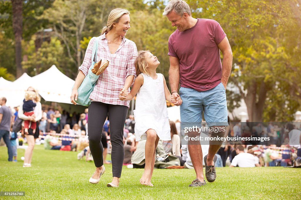 Family Relaxing At Outdoor Summer Event