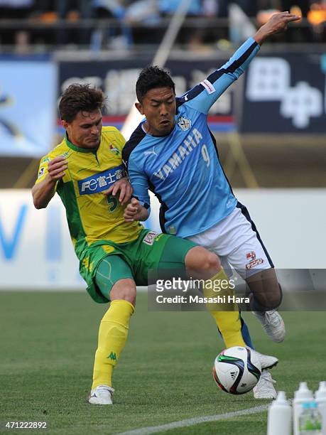 Yoshiaki Ota of Jubilo Iwata and Paulinho of JEF United Chiba compete for the ball during the J.League second division match between JEF United Chiba...