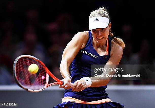 Angelique Kerber of Germany hits a backhand during the Ladies Singles Final match against Caroline Wozniacki of Denmark on day 7 of the Porsche...