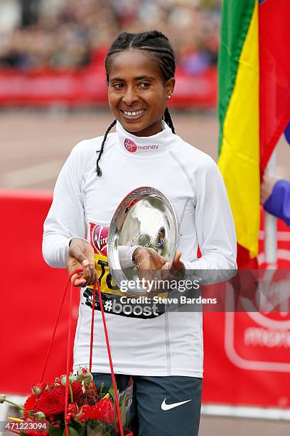 Women's race winner Tigist Tufa of Ethiopia celebrates with trophy following the Virgin Money London Marathon on April 26, 2015 in London, England.