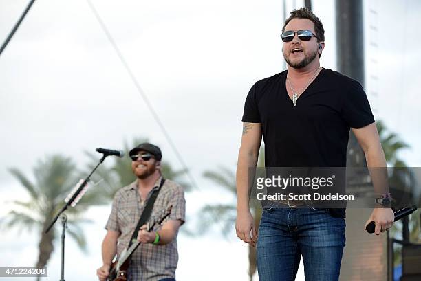 Guitarist James Young and singer Mike Eli of the Eli Young Band performs onstage during day 2 of the Stagecoach Music Festival at The Empire Polo...
