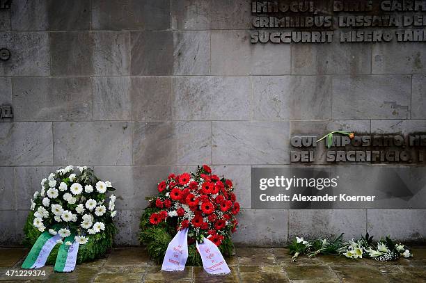 Wreath are seen in front of a memorial plaque during a ceremony to commemorate the 70th anniversary of the liberation of the Bergen-Belsen...