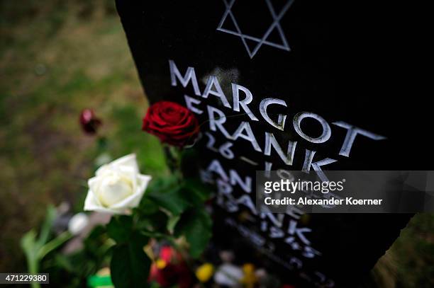 Flowers and stones lay on and in front of the gravestone of Margot Frank and Anne Frank after a ceremony to commemorate the 70th anniversary of the...