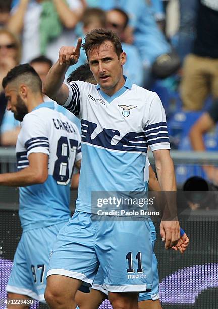 Miroslav Klose of SS Lazio celebrates after scoring the opening goal during the Serie A match between SS Lazio and AC Chievo Verona at Stadio...
