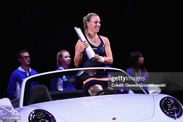 Angelique Kerber of Germany celebrates after her victory in her final match against Caroline Wozniacki of Denmark during Day 7 of the Porsche Tennis...