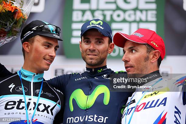Race winner Alejandro Valverde of Spain and Movistar Team celebrates his victory with second placed Julian Alaphilippe of France and Etixx - Quick...